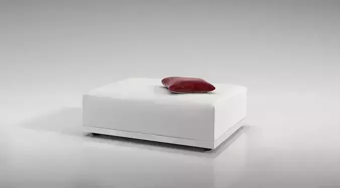 White Leather Ottoman With A Red Pillow