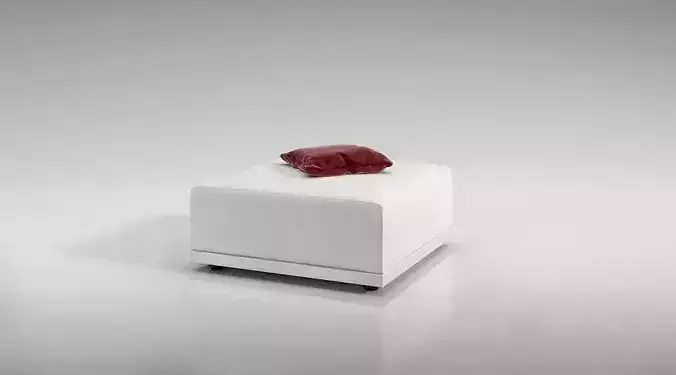 White Ottoman With A Red Pillow