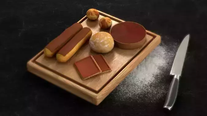 Pastries chocolates and on wooden cutting board