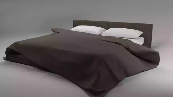 Large bed in a modern style with a blanket and pillows