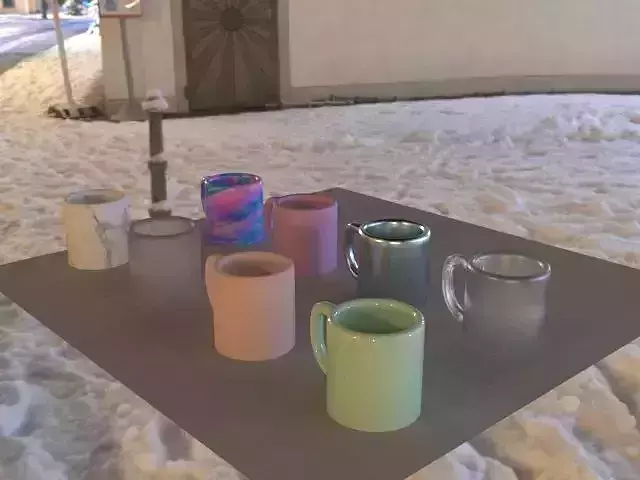 Cupss mugs on table in snow