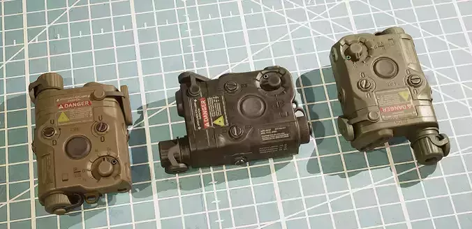 ANPEQ15 three military devices on cutting mat