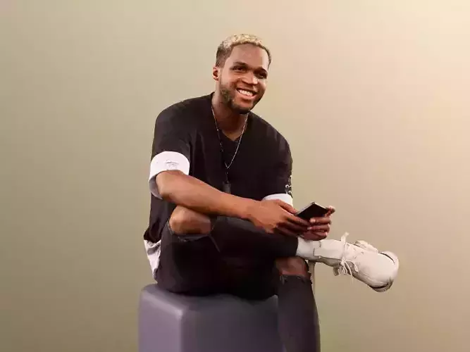 Maverick 12153 - Black Man Sitting With Smartphone And Laughing  Low-poly 3D model