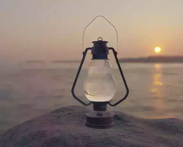 Lantern old on rock at sunset