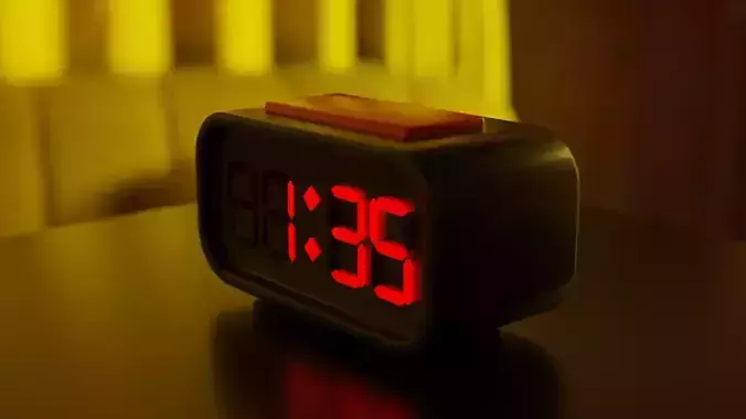 Clock alarm on table