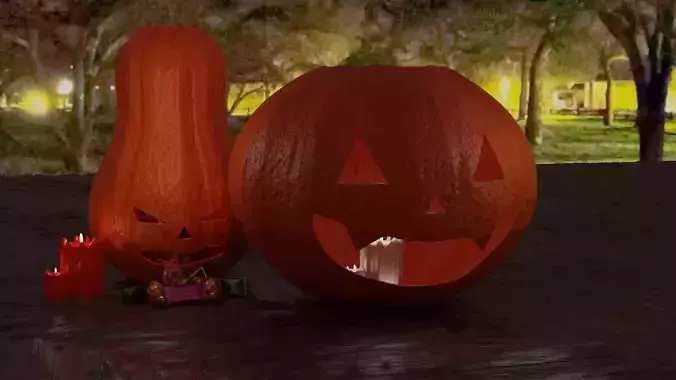 Halloween pumpkins with candies and candles