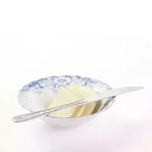 Butter In A Bowl And Knife