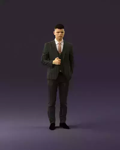 man in dark gray quads suit hand on jacket 1085