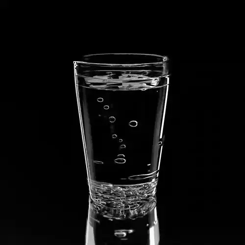 Water glass of with bubbles in it