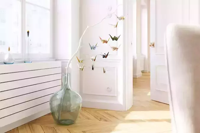 Large glass carboy with decorative origami birds