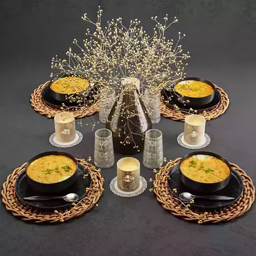 Tableware001 table setting with bowls of soup and candles