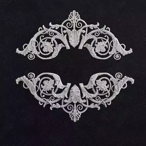 Decor pair of silver ornate ornaments