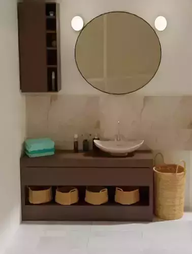 Bathroom with round mirror and baskets