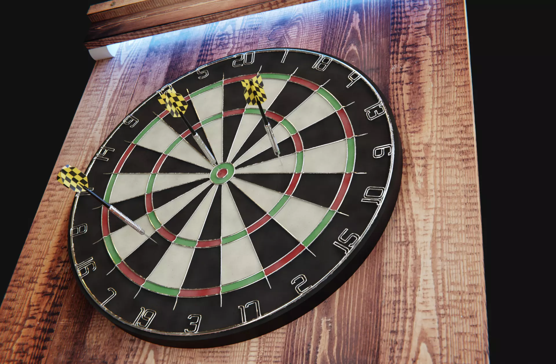 Dartboard with darts on wood plate 3D model