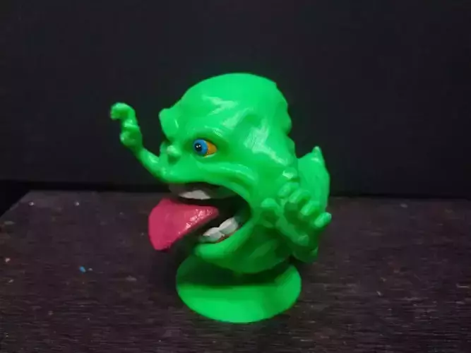 Pegajoso toy monster with tongue out