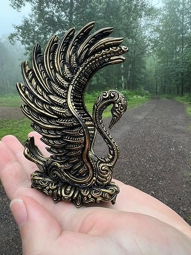 Swan print bronze in hand of person 3D print model