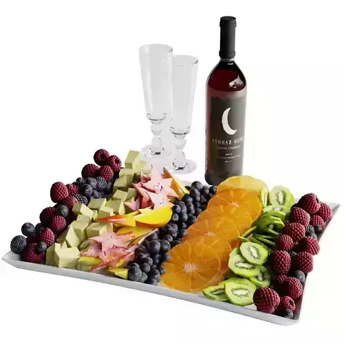 Fruit plate with a glass of red wine