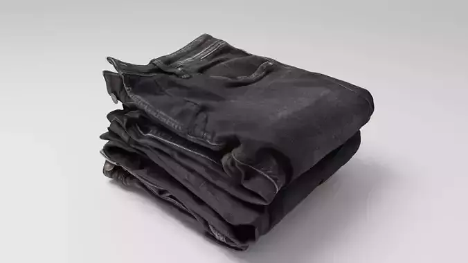 Pile or stock of folded black jeans pants for wardrobe