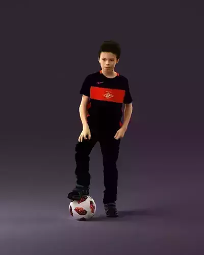 001057 kid sockerplayer in black with ball