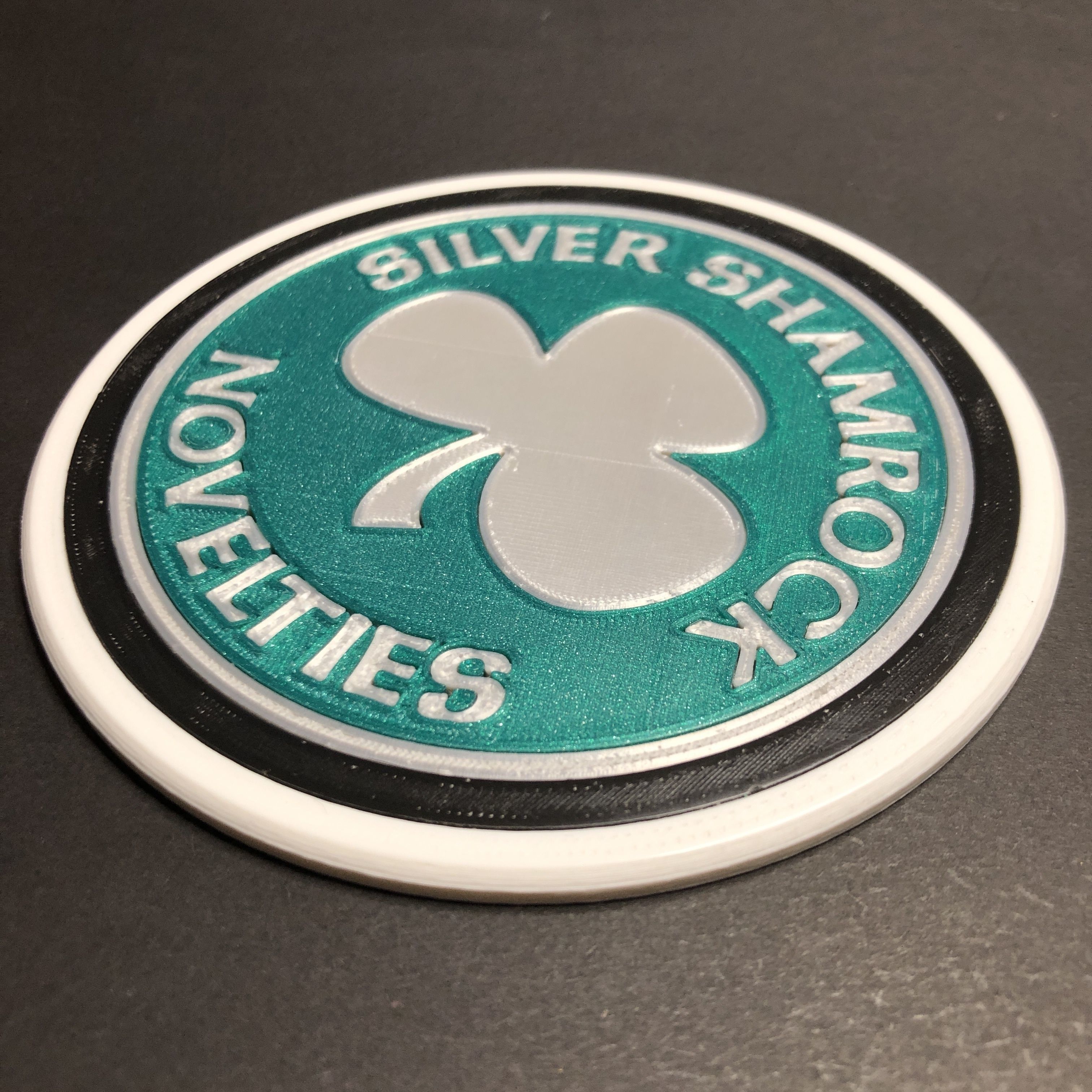 Silver Shamrock Novelties Logo Coaster 3D print model_1