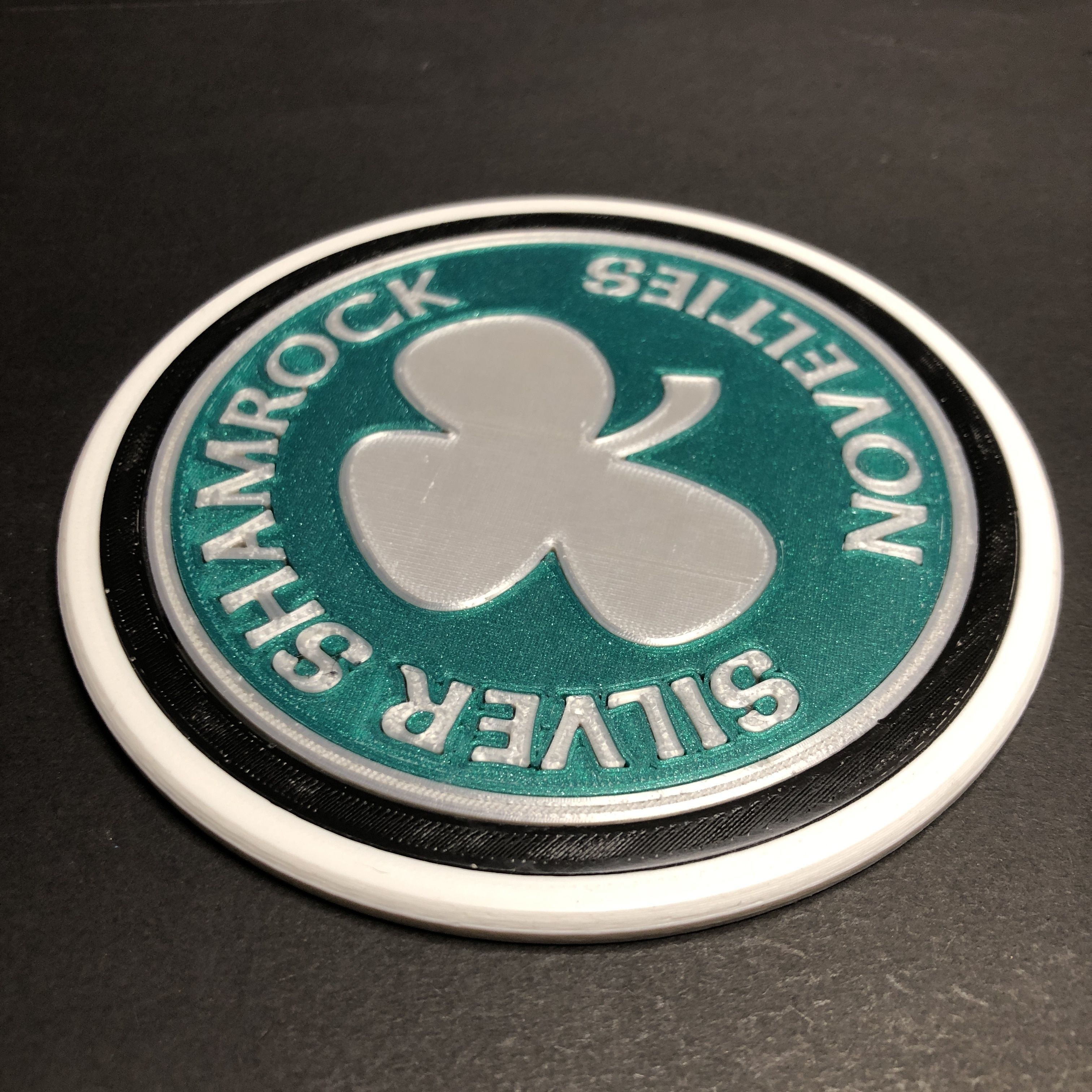 Silver Shamrock Novelties Logo Coaster 3D print model_3