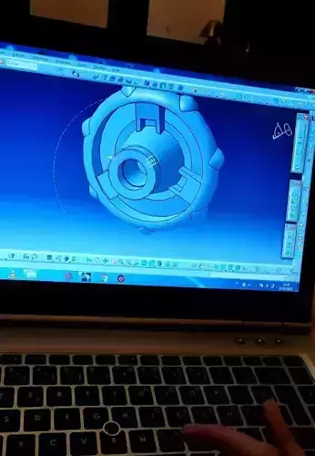 3d mechanical model person using laptop with design Free 3D model