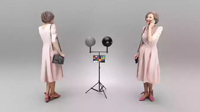 Mature woman in dress talking on mobile phone 358