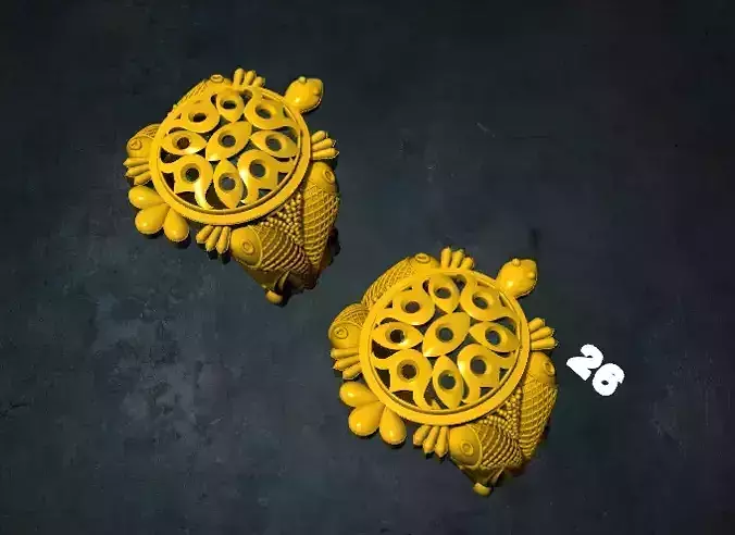 tortois pair of earrings with ornate design