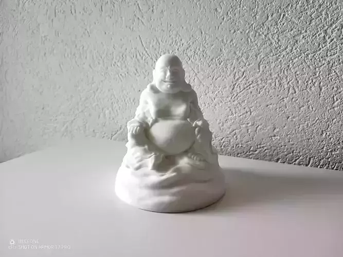 Buddha gold statue on table