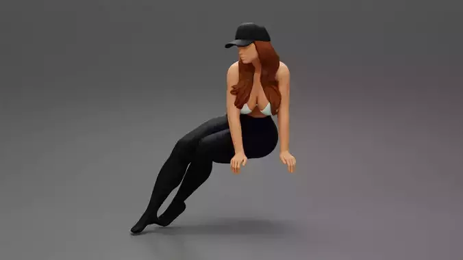 Sexy woman in pants bra and cap sitting on chair