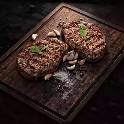 Steak two grilled steaks on wooden cutting board 3D model