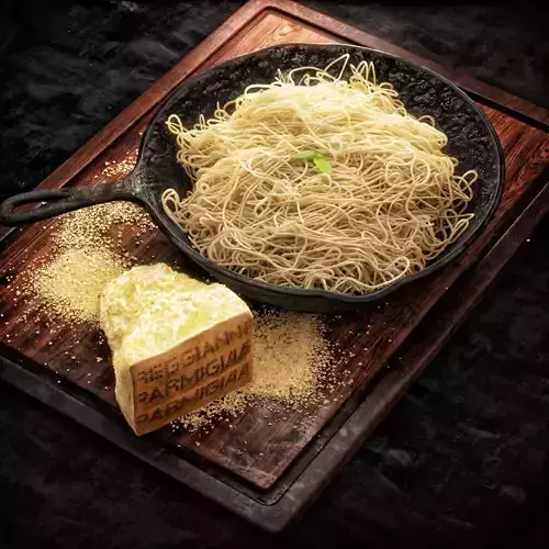 Spaghetti pan with noodles and parmesan cheese