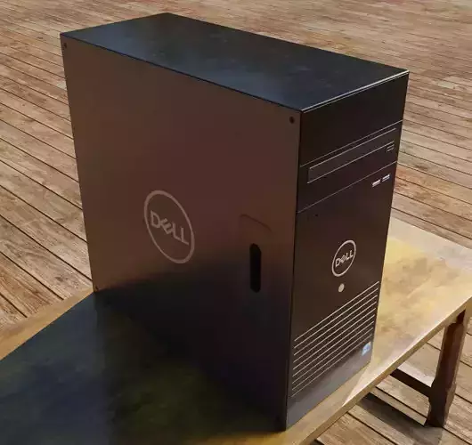 Realistic CPU dell desktop computer on wooden table