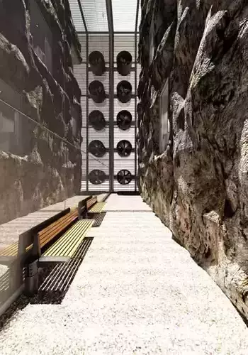 Spacious Hall With Rock Wall And Benches