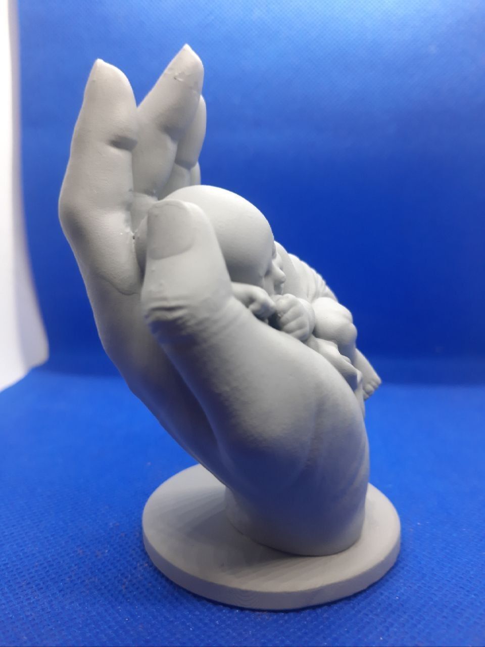 the baby is sleeping in the hand 3D print model_9