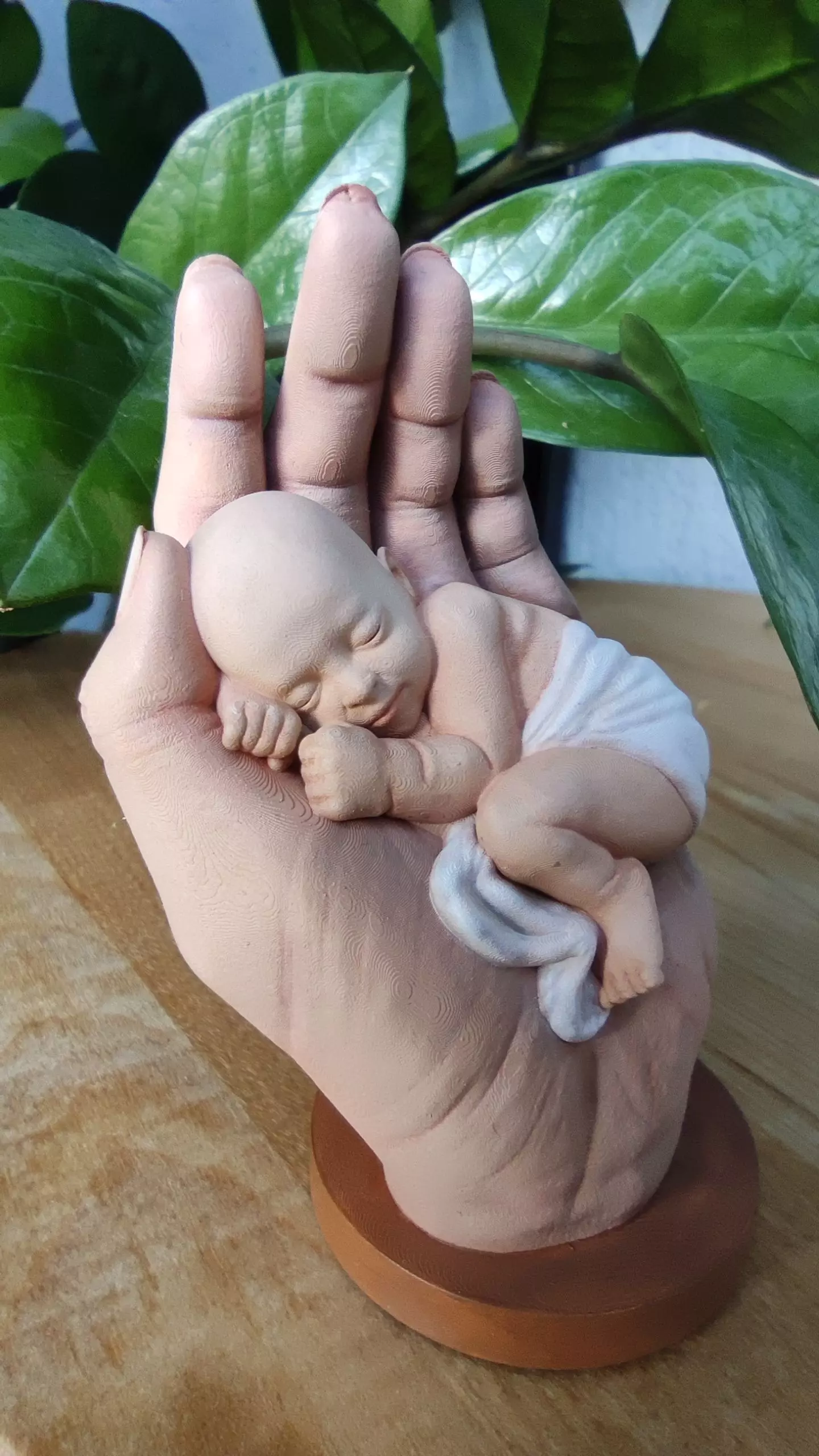the baby is sleeping in the hand 3D print model_0