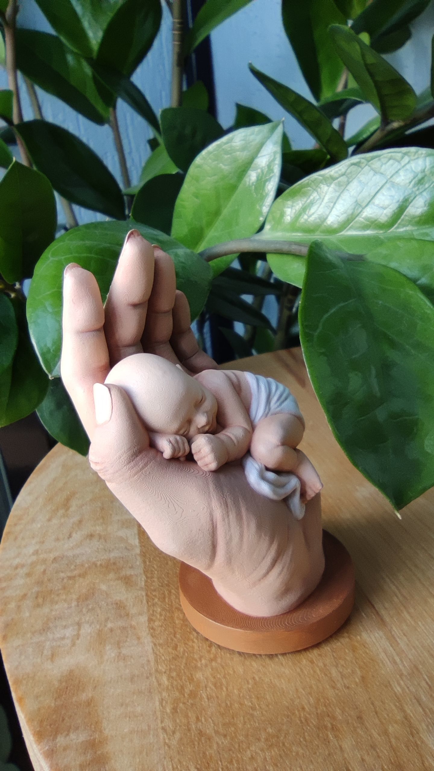 the baby is sleeping in the hand 3D print model_3