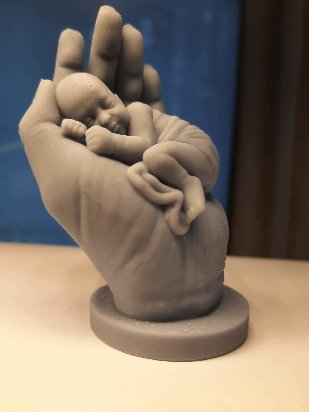 the baby is sleeping in the hand 3D print model_1