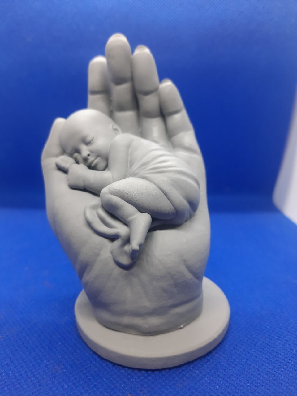 the baby is sleeping in the hand 3D print model_12