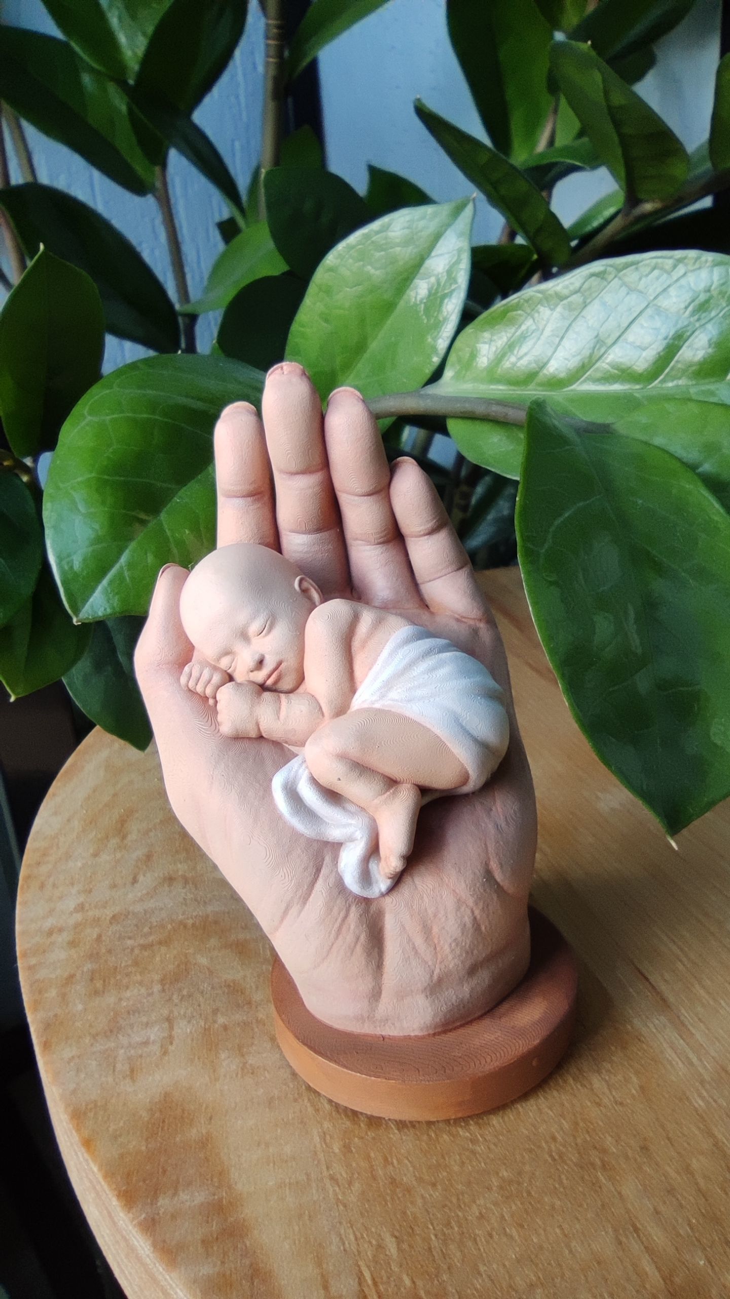 the baby is sleeping in the hand 3D print model_2