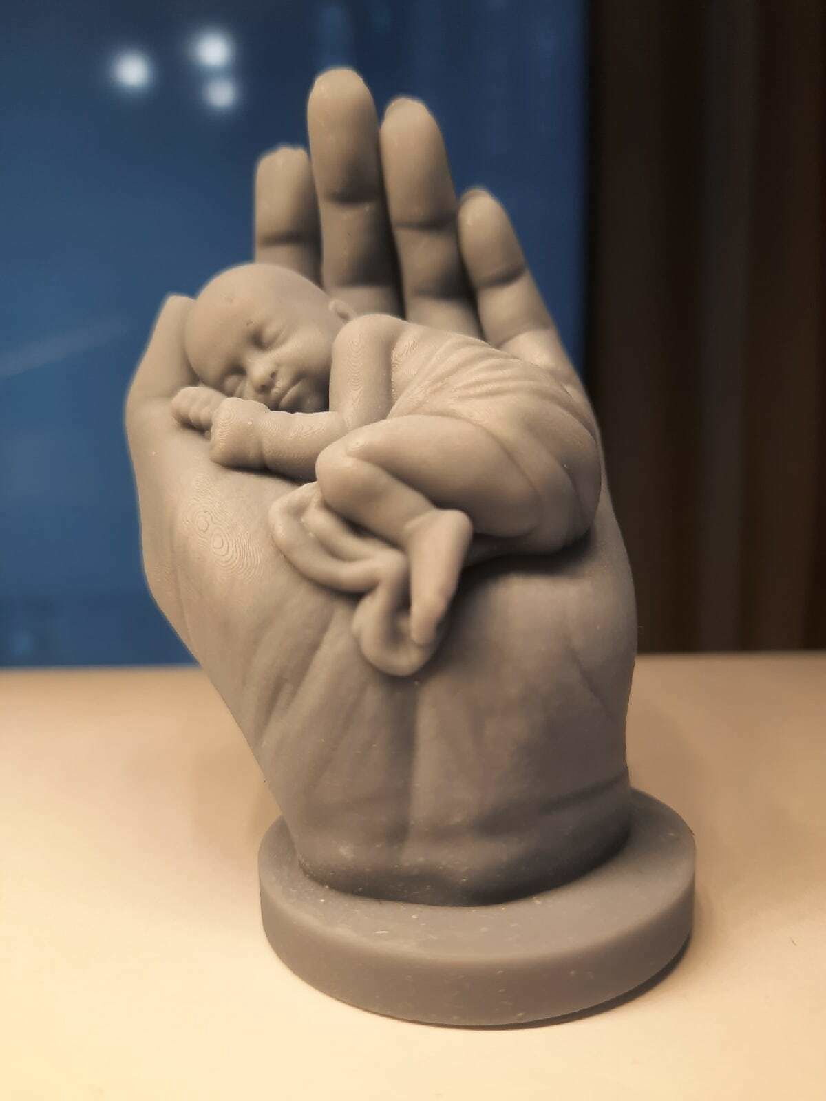 the baby is sleeping in the hand 3D print model_7