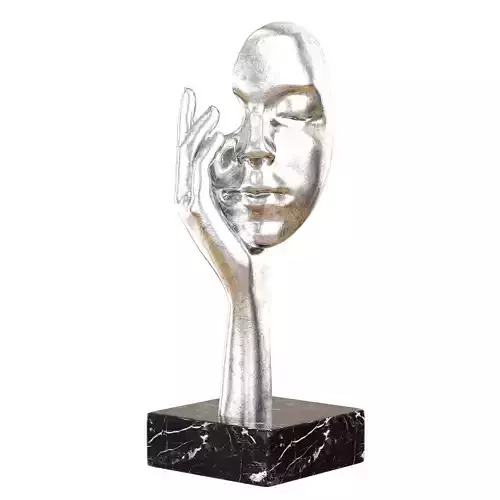 Decorative figurine face in hand