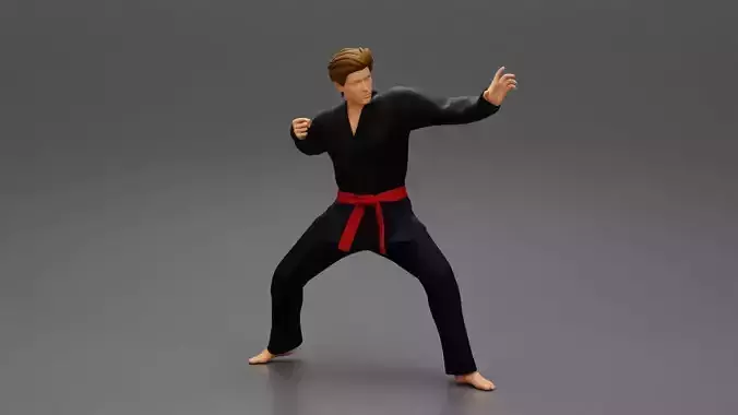 Karate man in a black kimono with a red belt