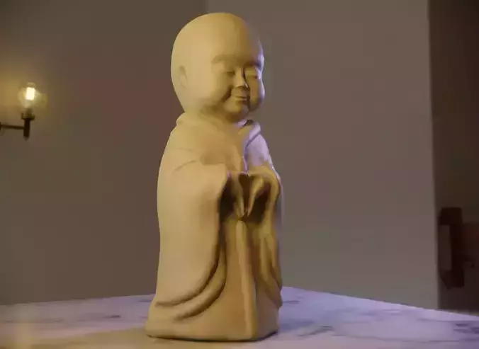 Happy baby monk sculpture