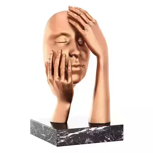 Statuette face in hands