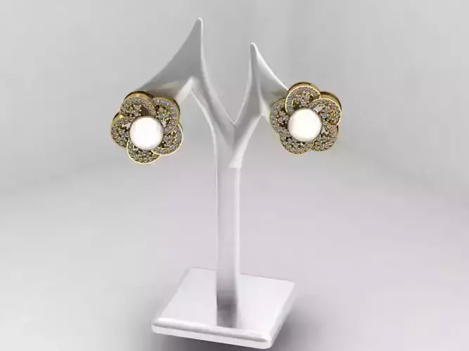 woman gold pearl earing 