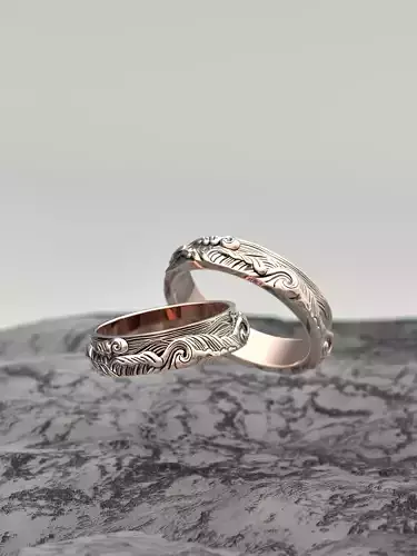 Wedding rings in the shape of a sea wave