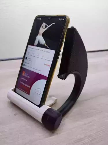 Telephone holder with acoustic amplifier