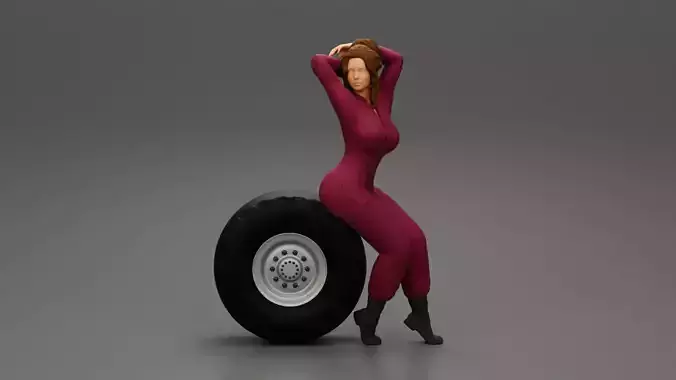 Girl mechanic in suit sitting on a truck tyre and hands in hair