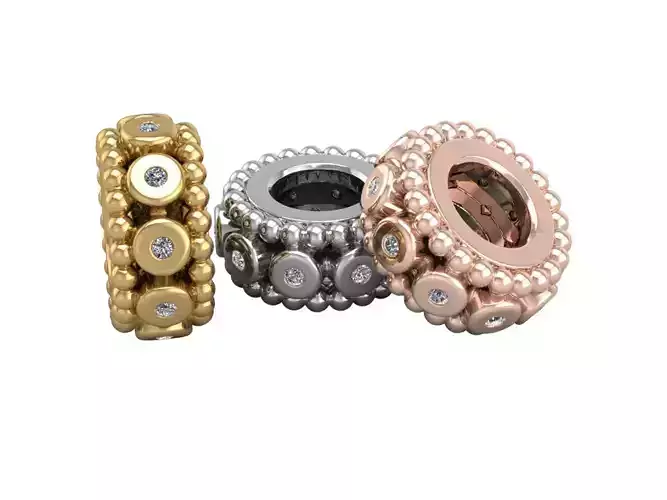 gold charm with gems